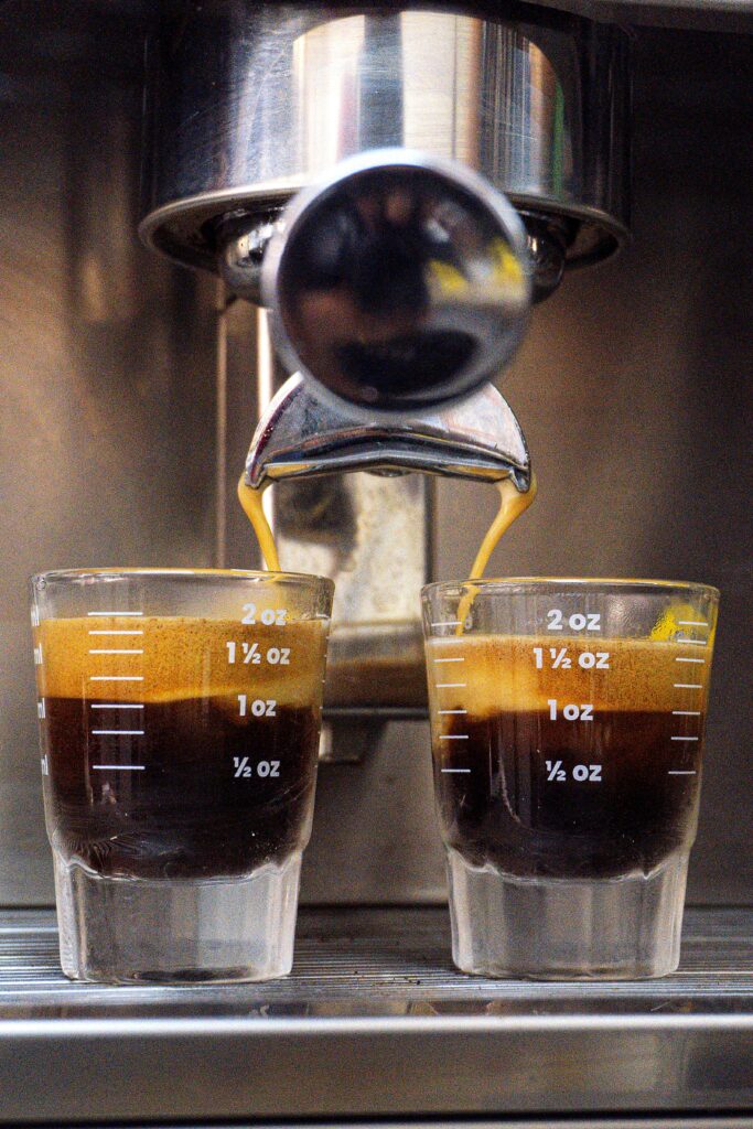 Espresso machine brewing two shots of coffee. Perfect for coffee lovers.