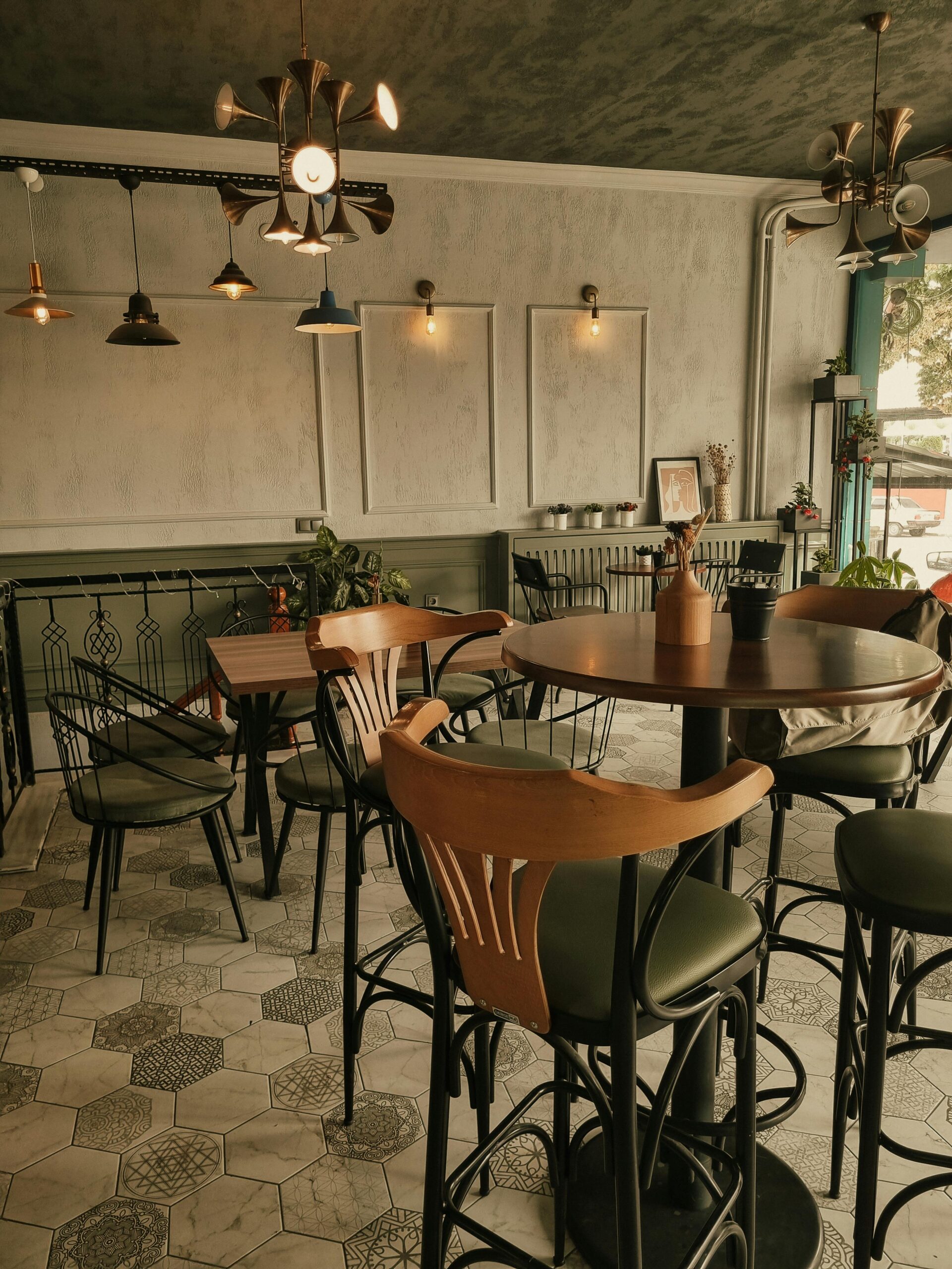 A warm, cozy vintage-style café interior featuring elegant furniture and ambient lighting.